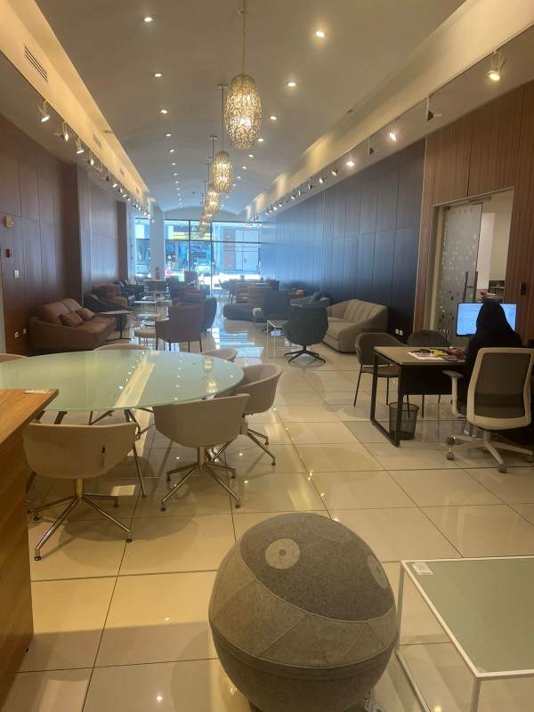 Modern bathroom double vanity, wall-mounted faucets, tiled walls commercial rental Obarrio Panama