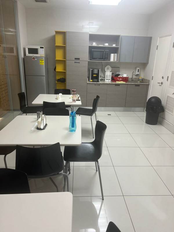 Office kitchen break area with tables, refrigerator, microwave commercial rental Obarrio Panama
