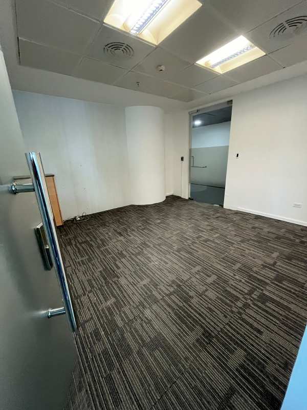 Empty corporate office with drop ceiling curved walls carpet floor Punta Pacifica Oceania Tower Panama