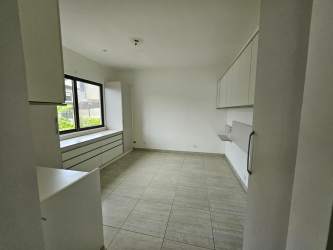Modern walk-in closet featuring built-in shelving, tile floors Nativa Panama Pacifico