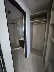 Elegant bathroom featuring large soaking tub, modern vanity, and natural light Nativa Panama Pacifico