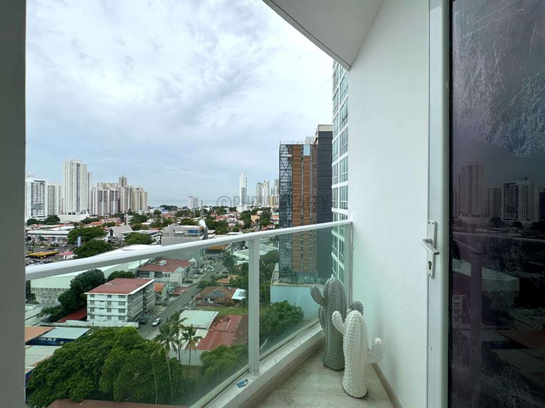 Covered balcony with city skyline view in PH Acuarela San Francisco Panama