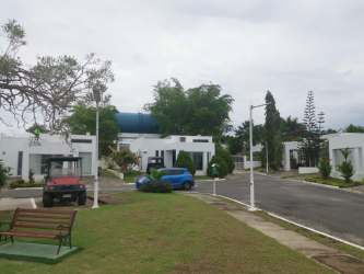 Lush tropical garden with pool view at Las Guias beachfront community Panama