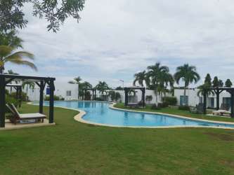 Spacious bedroom with tiled flooring and AC at Las Guias Beach House for sale Panama