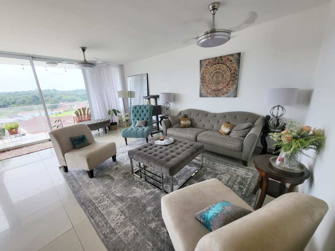 Contemporary living room space at PH Pine Hill with floor-to-ceiling windows and stylish furniture