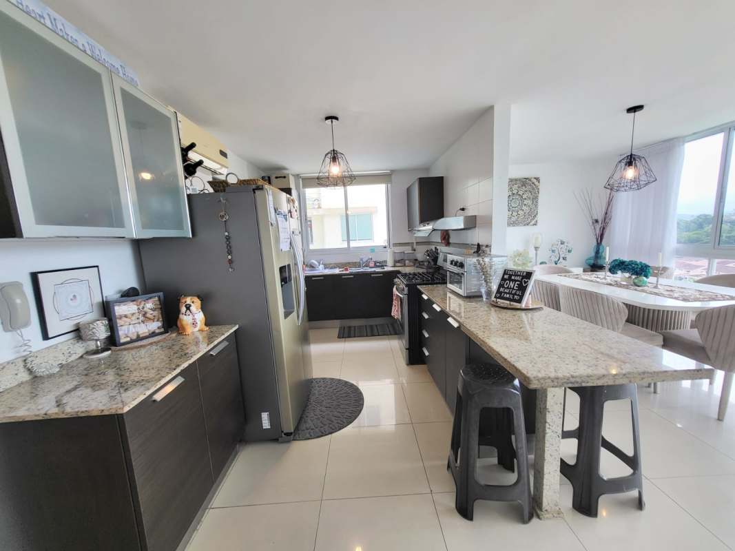 Modern open kitchen with granite countertops dining area PH Pine Hill Panama