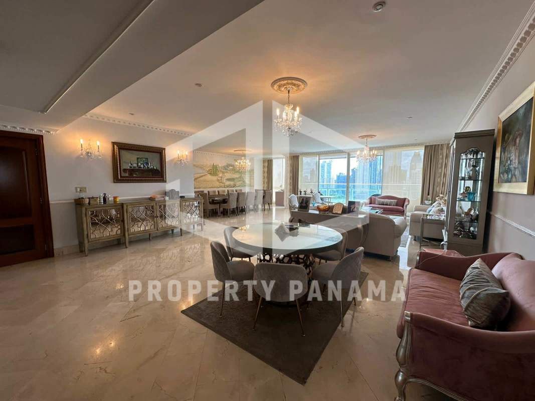 Closed kitchen with granite countertops wood cabinetry stainless appliances in PH Península luxury condo for sale Punta Paitilla Panama City