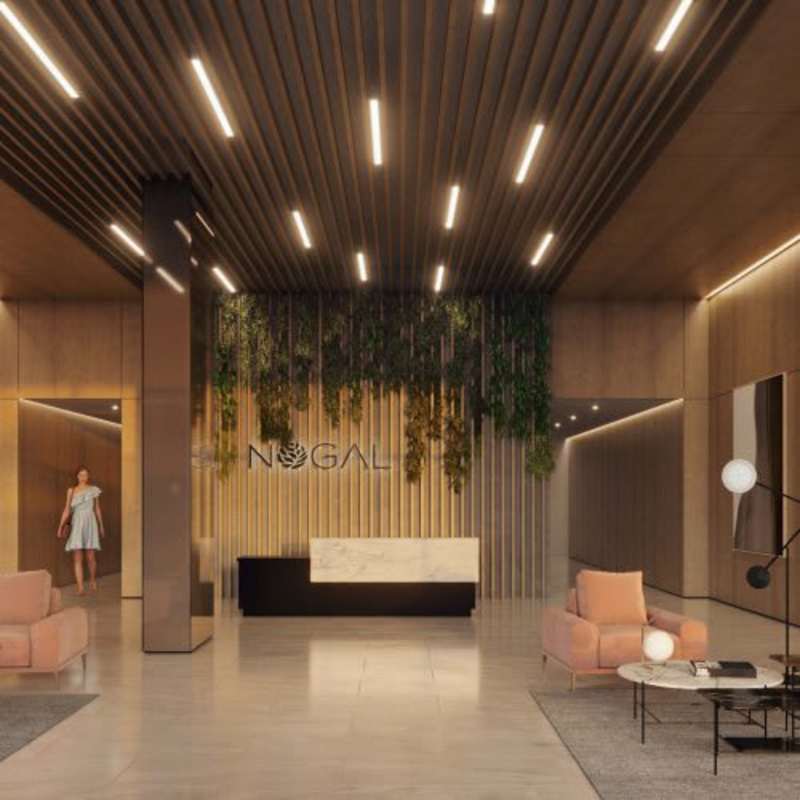 Infinity pool with lounge chairs and skyline backdrop at PH Nogal Costa del Este