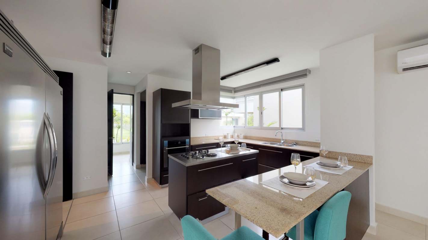 Spacious master bedroom with balcony and city views in Villasur Costa Sur Panama