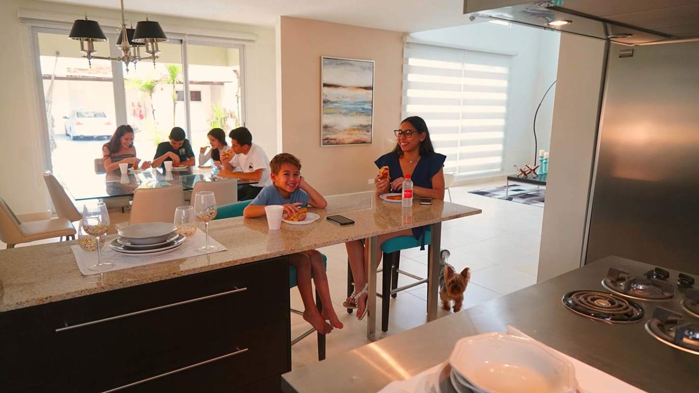 Minimalist bright living room with large windows and neutral tones in Villasur Panama