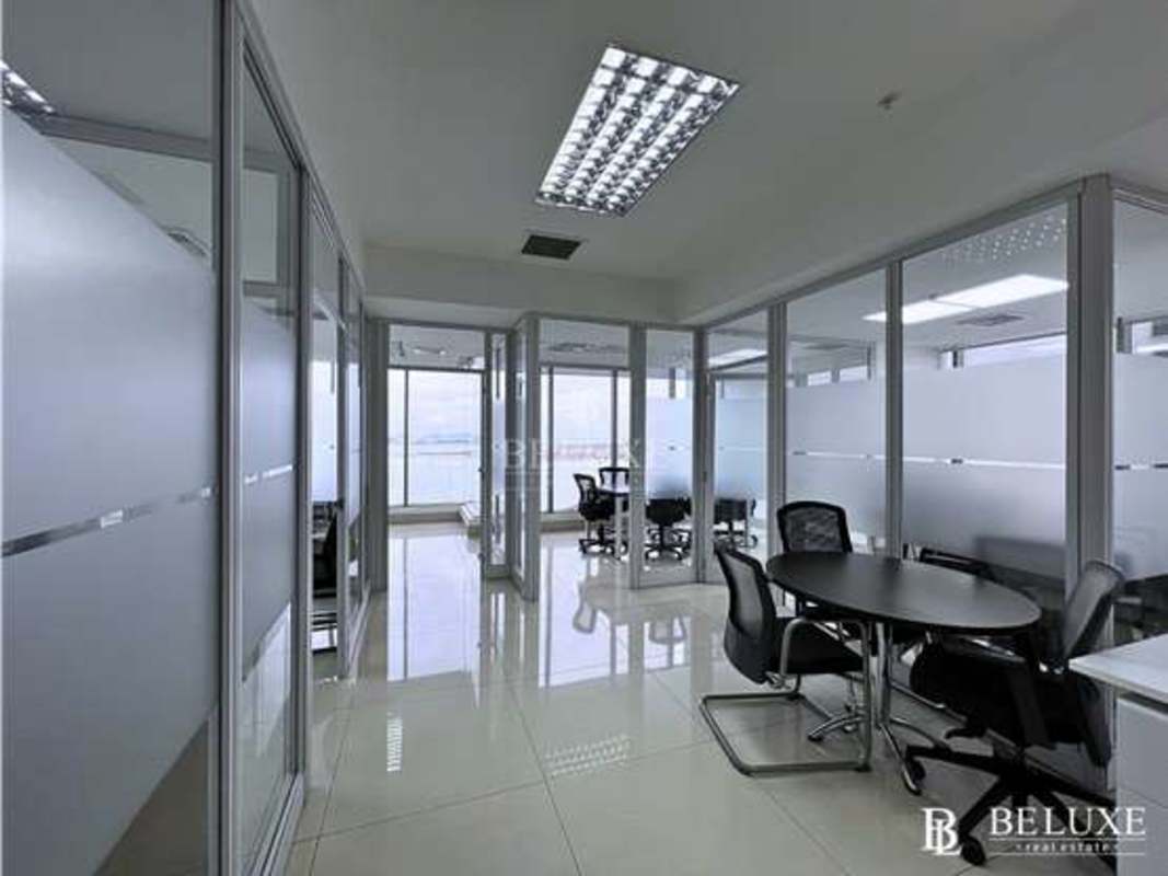 Private glass enclosed executive office with skyline view at PH BICSA Marbella Panama