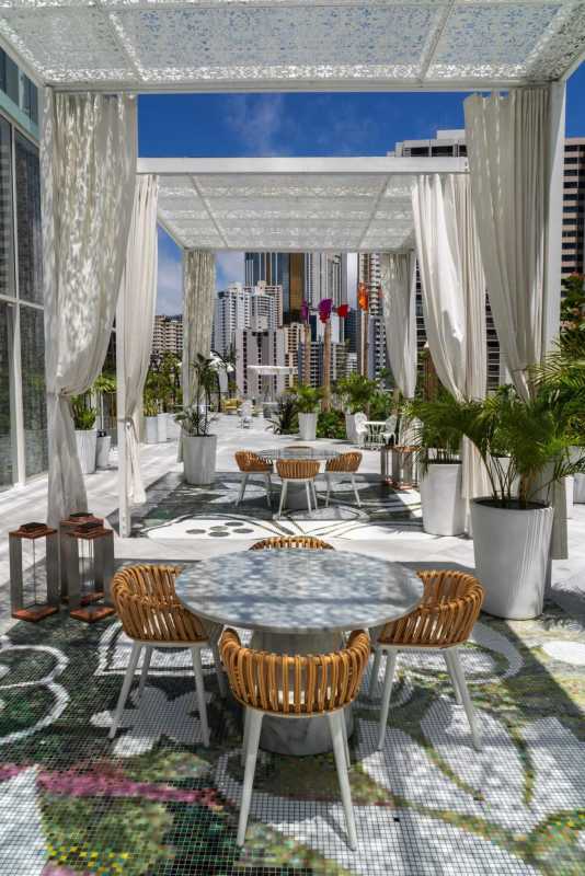 Indoor panoramic sky lounge with city view and greenery at PH Wanders & Yoo Panama