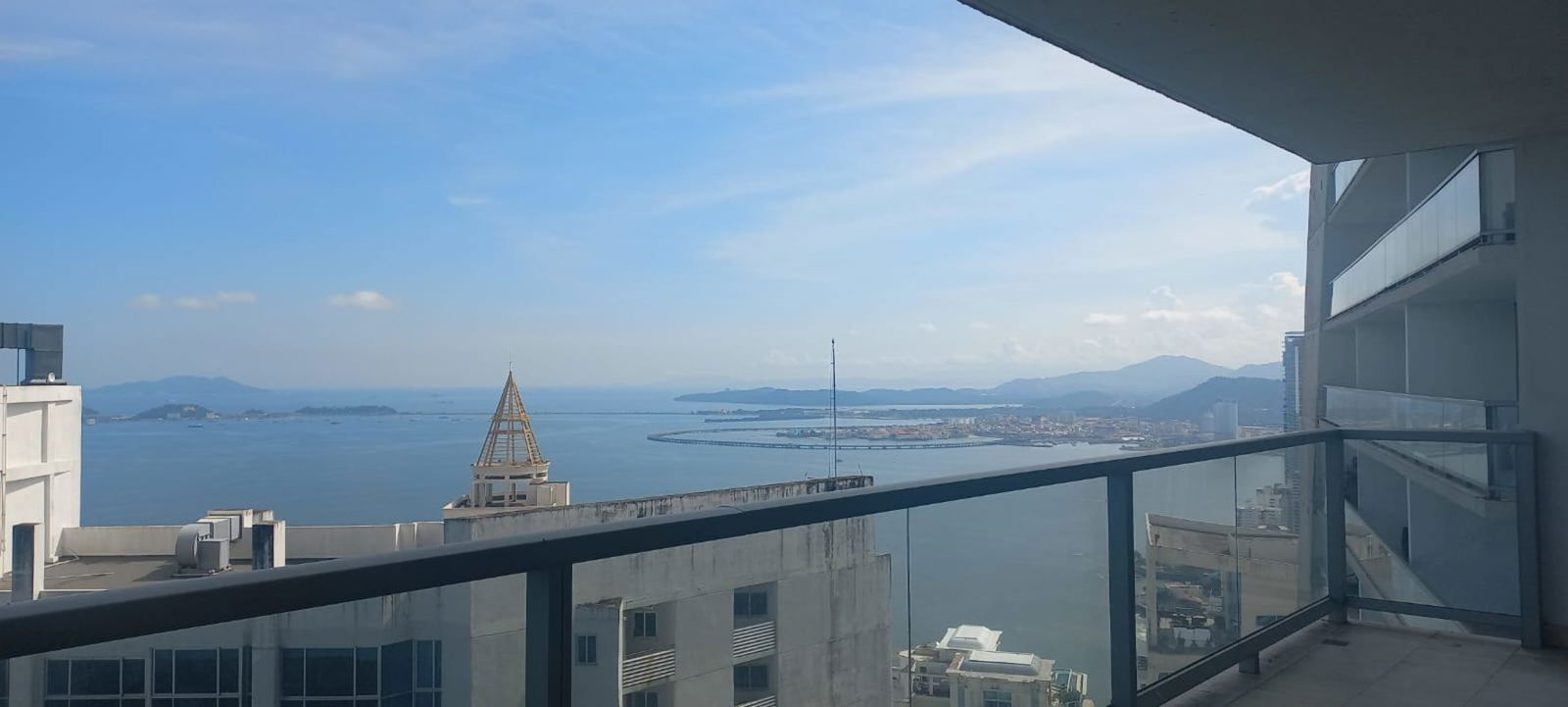 Bright living area with glass walls showing Pacific Ocean in PH The Ocean Club Panama