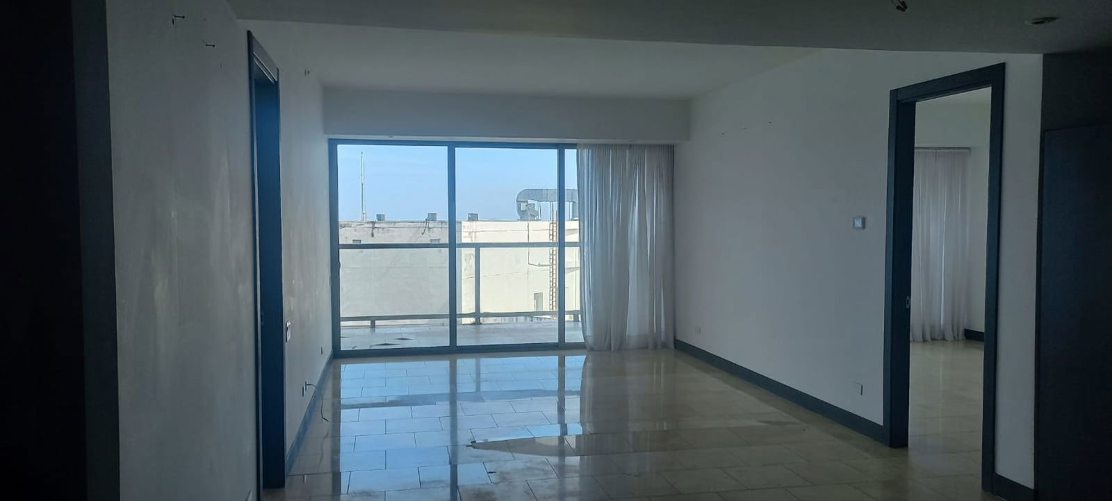 Minimalist bathroom beige tiles glass shower PH The Ocean Club Panama