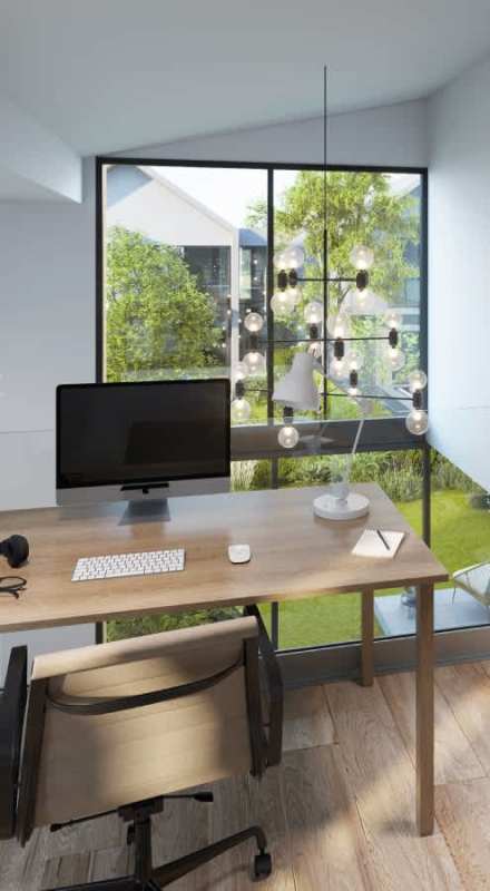 Open living and dining area with large windows and double height ceiling in Aurora Green City house Panama