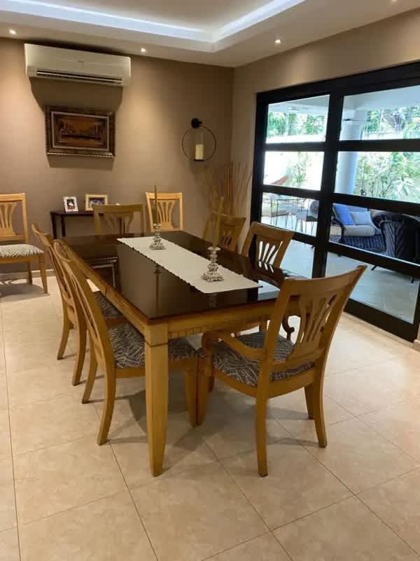 Mediterranean home covered patio overlooking lush garden Costa del Este Panama