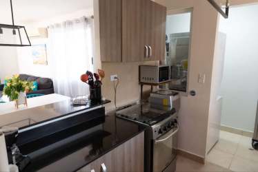 Modern kitchen with granite countertop in Punta Paraíso Village Nueva Gorgona