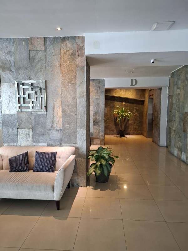 Modern lobby with lounge furniture and luxury finishes PH Harmony Tower San Francisco Panama City