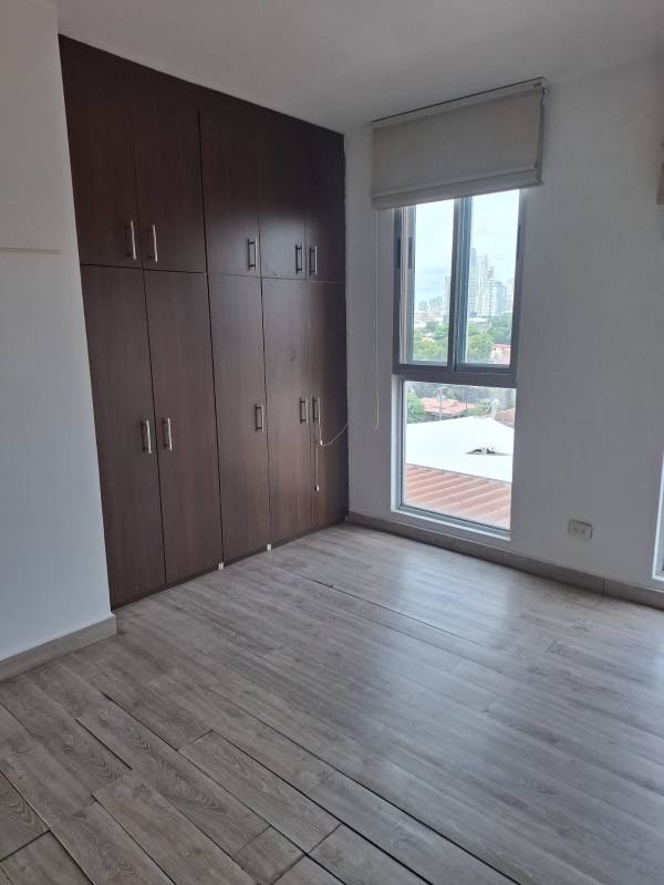 Modern kitchen with granite counters, U-shape design, breakfast bar at PH Harmony Tower Panama City