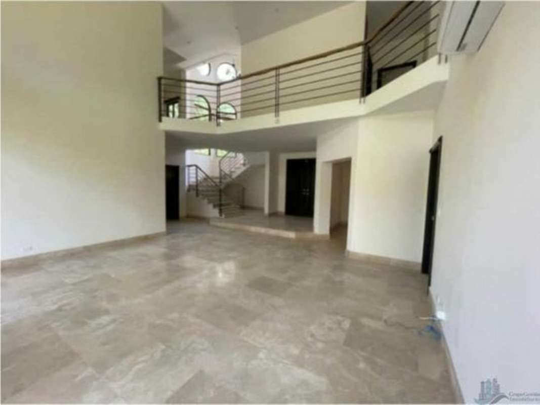 Modern kitchen with island, granite countertops and stainless steel appliances in luxury house Panama