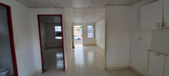 Empty living room area with tiled flooring in affordable Panama house