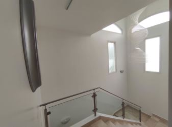 American style kitchen with granite countertops, appliances, and island in Eagle Model house at Tucán Country Club Panama