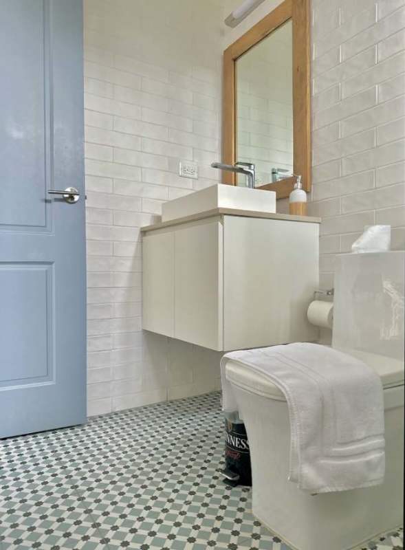 Hallway with glass partition, bedroom with minimalist decor in Casco Viejo Panama