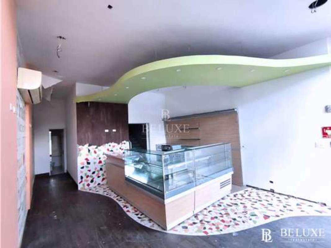 Industrial kitchen with stainless steel worktable, appliance setup in commercial property Plaza 68 San Francisco Panama