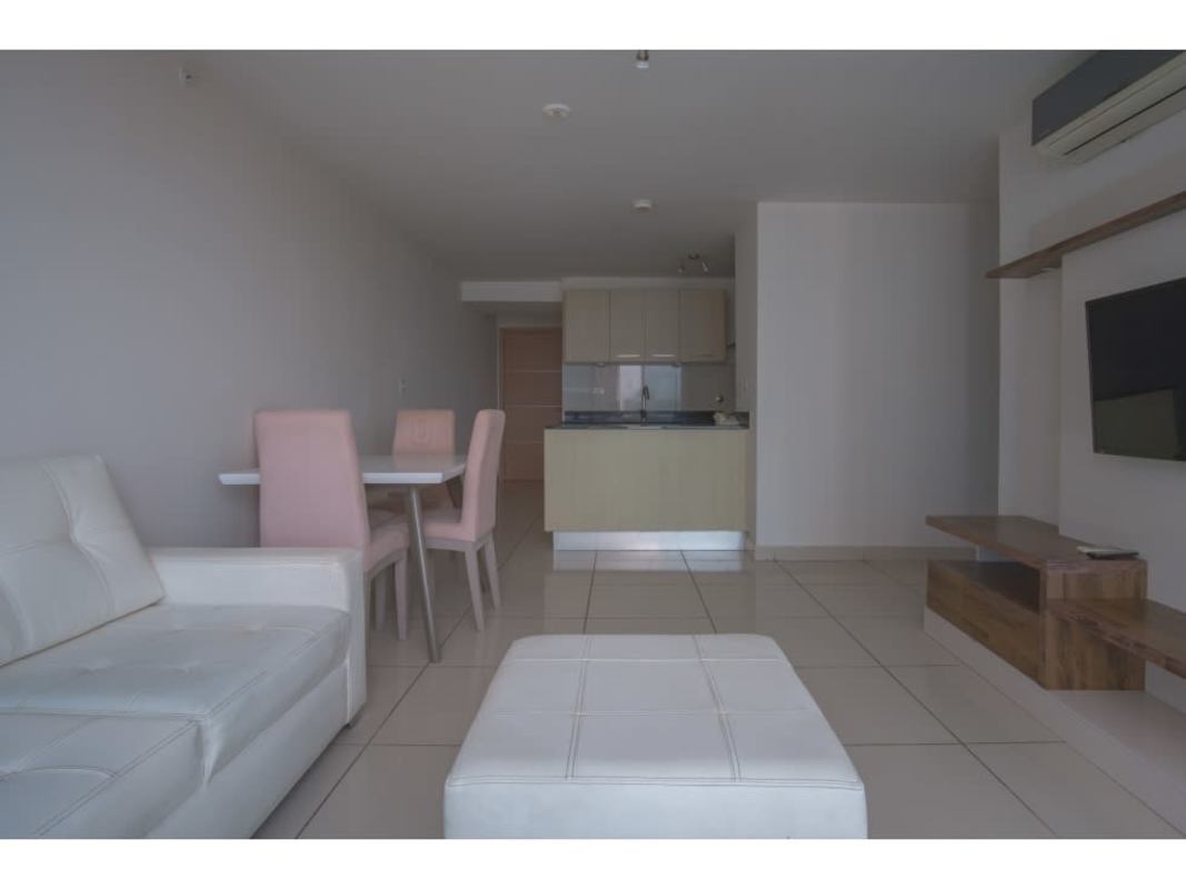 Bedroom with large window and city skyline view PH Torres de Castilla Panama