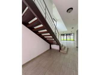 Spacious kitchen with natural light and tile flooring at PH Nativa house Panama Pacifico