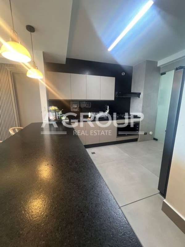 Contemporary kitchen stylish lighting black countertops PH Victory Wellness Coco del Mar Panama