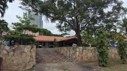 Mediterranean villa with driveway, terracotta roof, lush garden in Coronado Golf Panama