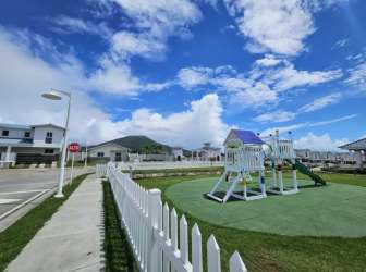 Parking lot and landscaped exterior in Playa Dorada community Vacamonte