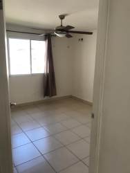 Empty bedroom with tile floor window in Playa Dorada house Panama Vacamonte