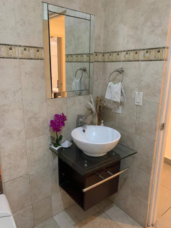 Contemporary bedroom with tufted bed, modern wallpaper, recessed lights Punta Pacifica condo