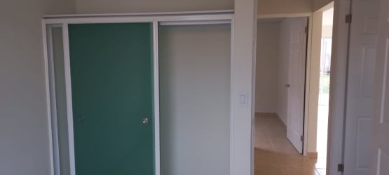 Bathroom with simple tile, shower, and toilet in Las Arboledas La Chorrera Panama