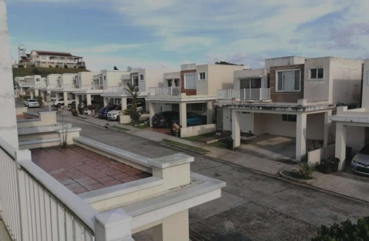 Two-story suburban homes with balconies and carports in PH Brisas Point Panama