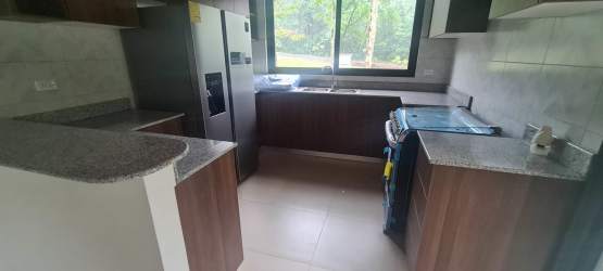 Modern kitchen with granite countertops, stainless appliances with garden view PH Valle Bonito Panama