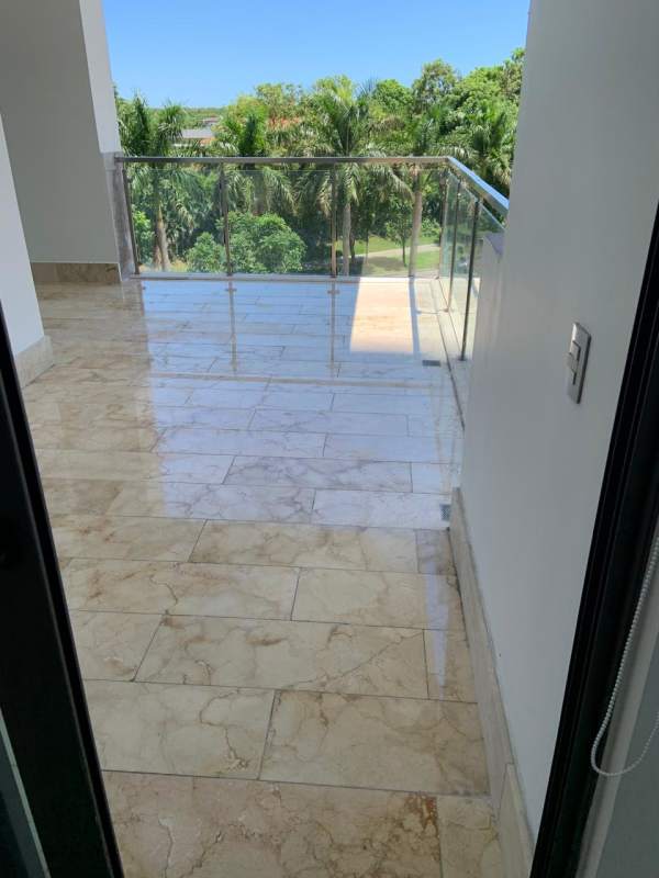 Modern bathroom with rain shower and glass enclosure at PH Vittoria Santa Maria Panama