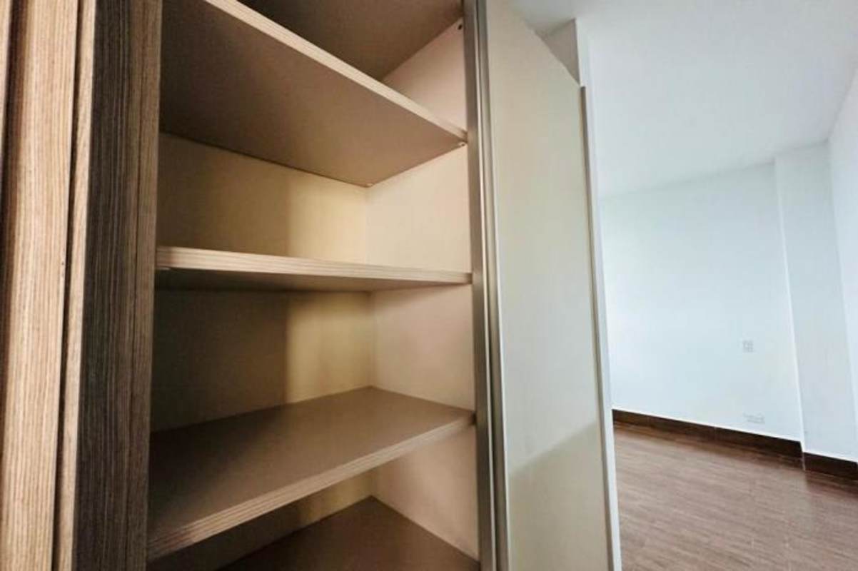 Minimalist bathroom with glass shower and neutral tiles in PH Costamare Panama