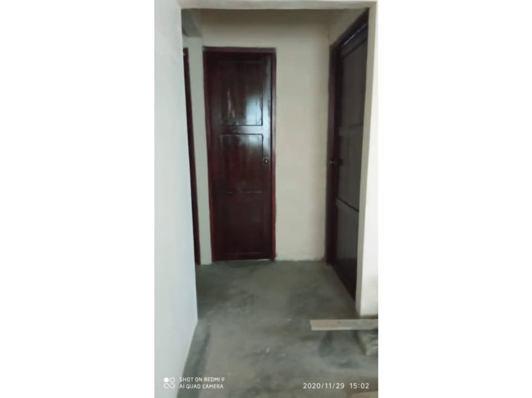 Interior light hallway wooden doors concrete floor Chepo house sale Panama