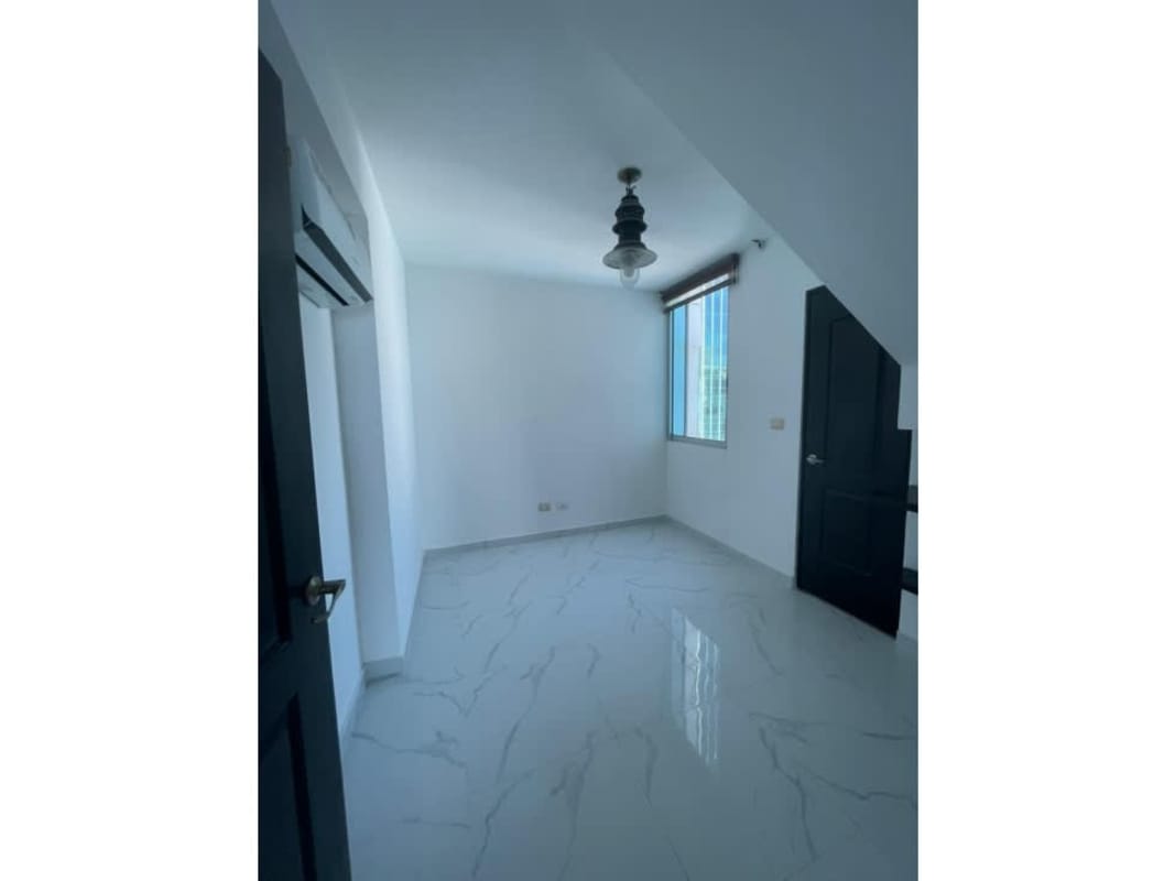 Spacious walk-in closet wood shelving tile floor PH Pacific Sky Punta Pacifica Panama