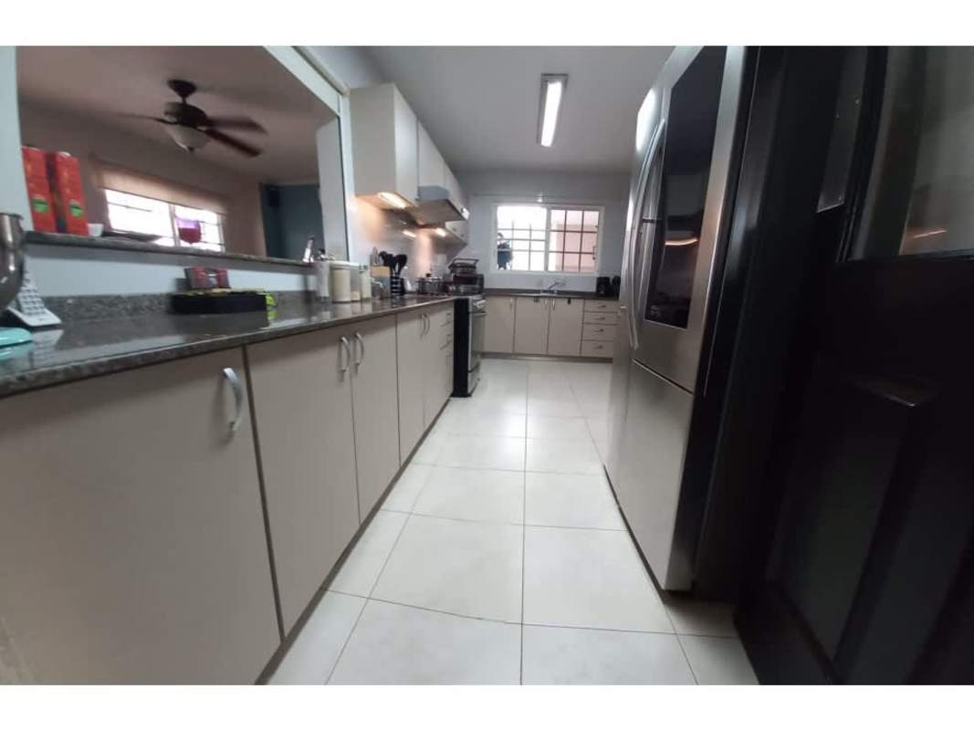 Front exterior view two-story Mediterranean house carport garden Villa Alta Panama