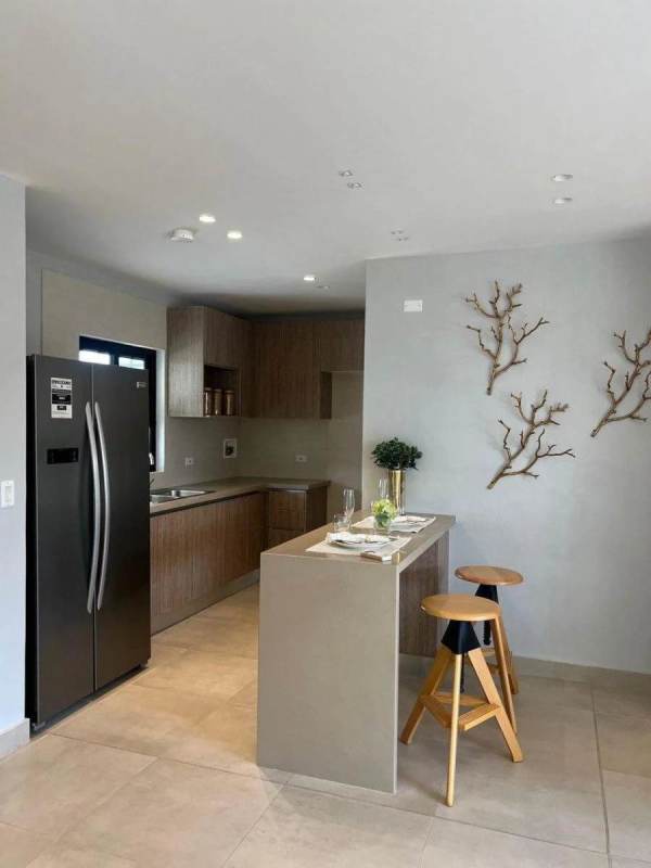 Modern kitchen with stainless appliances, double sink, ample light in Costa Sur PH Costa Linda Panama