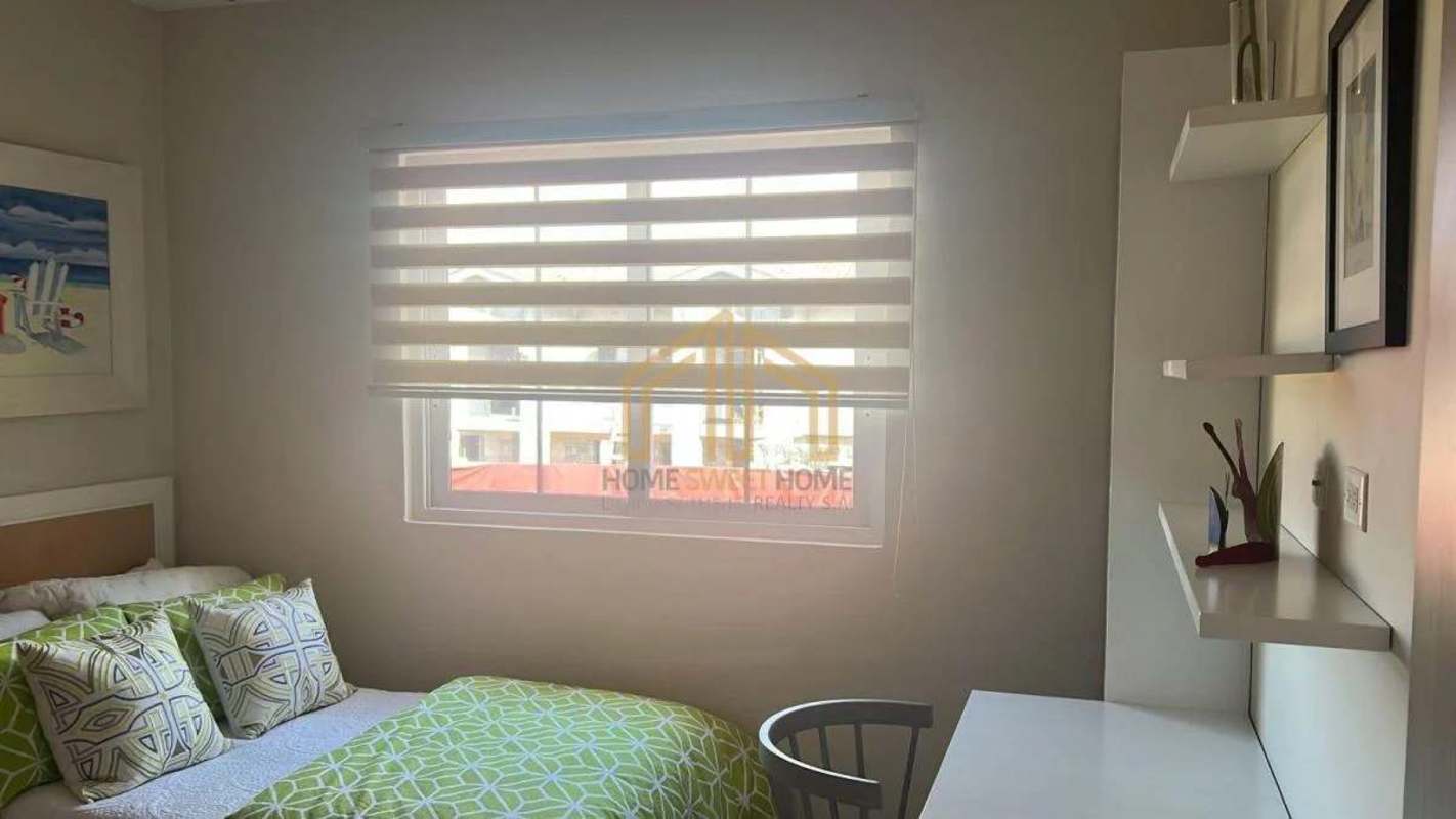 Modern kitchen with granite countertops light cabinetry living in Costa Sur Reserva de Versailles Panama City