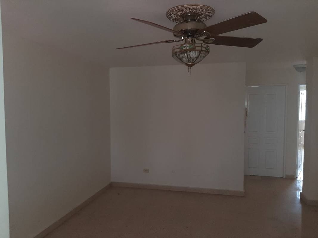 Secondary family room space with tile floors and ceiling fan in Los Angeles Betania Panama home