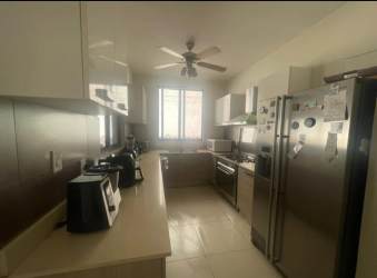 Kitchen with granite countertops, stainless appliances, ceiling fan in River Valley house Panama Pacifico