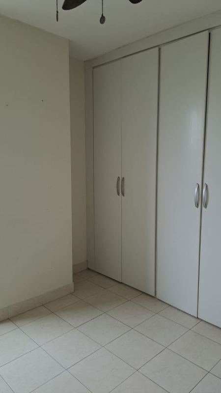 Kitchen with double sink, tiled backsplash and cabinetry in PH Majestic Gardens Panama City