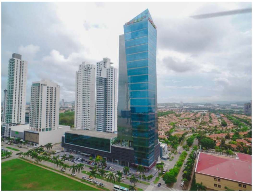 Ground level commercial storefronts with glass canopy entrance in Time Square Center business district Panama
