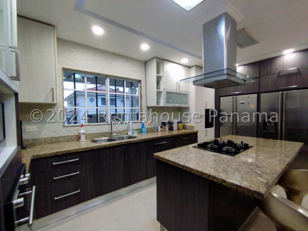 Bedroom in Bosque de Cibeles house featuring large windows and ensuite bathroom Panama